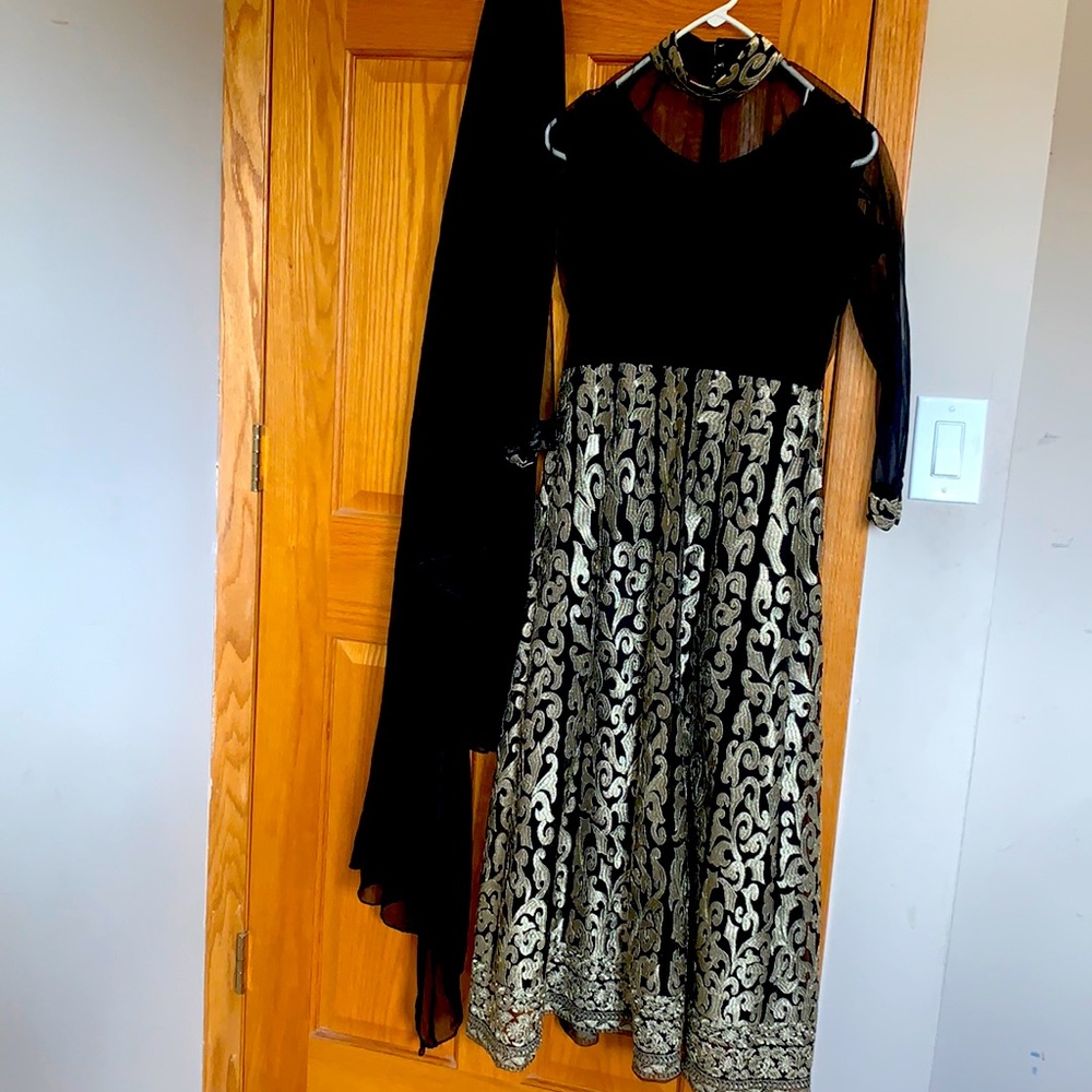 2 piece Pakistani suit. Comes with dupatta and a gown